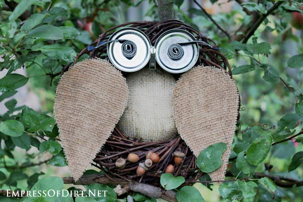 Garden art owl made from grapevine wreath and burlap.