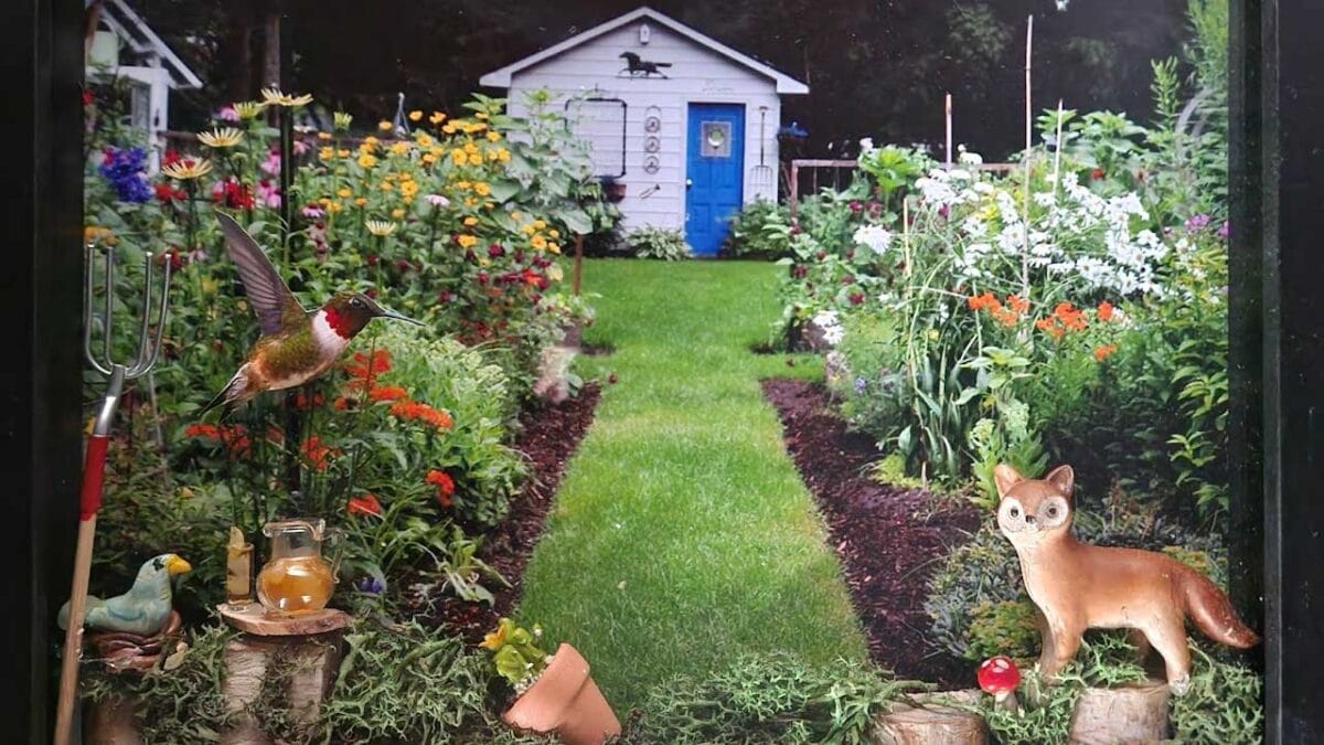 Garden shadow box with garden photo and miniatures.