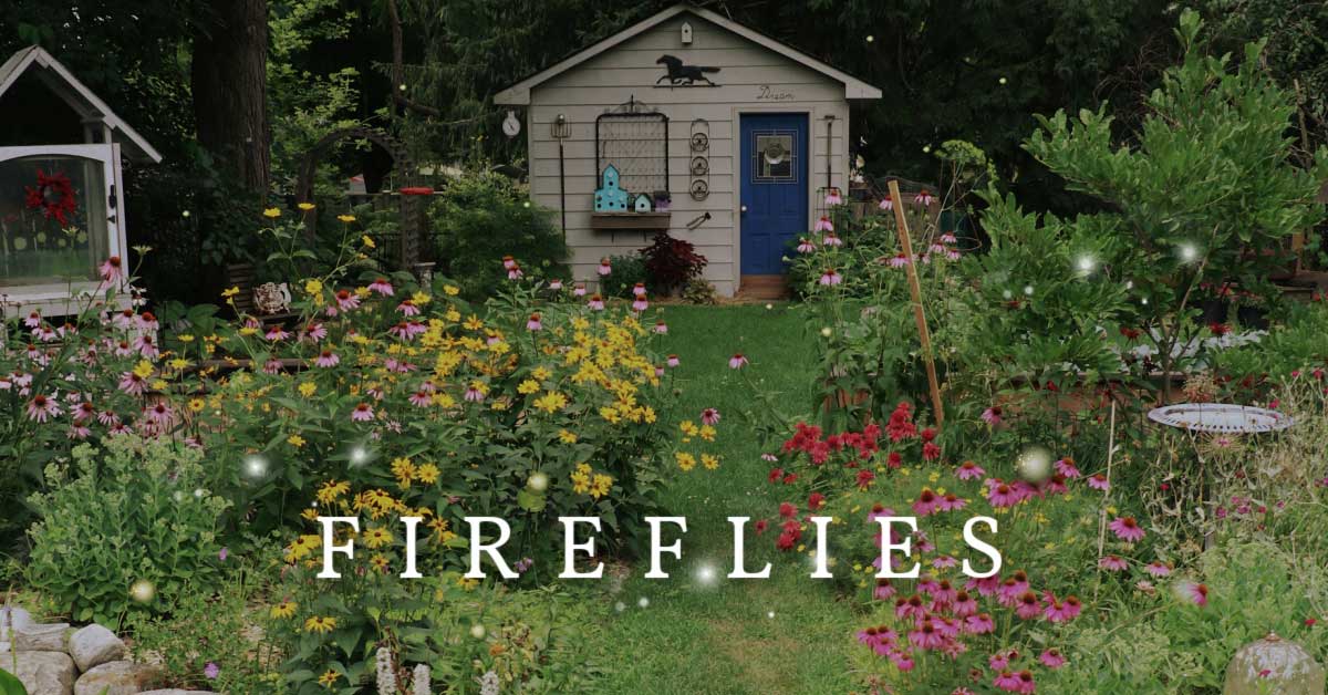 Backyard garden at dusk with fireflies glowing.