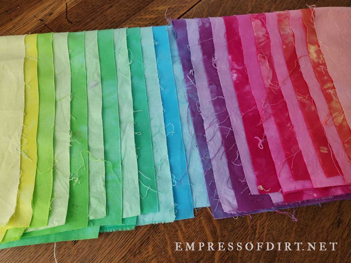 A rainbow dyed with spots and solid hands.