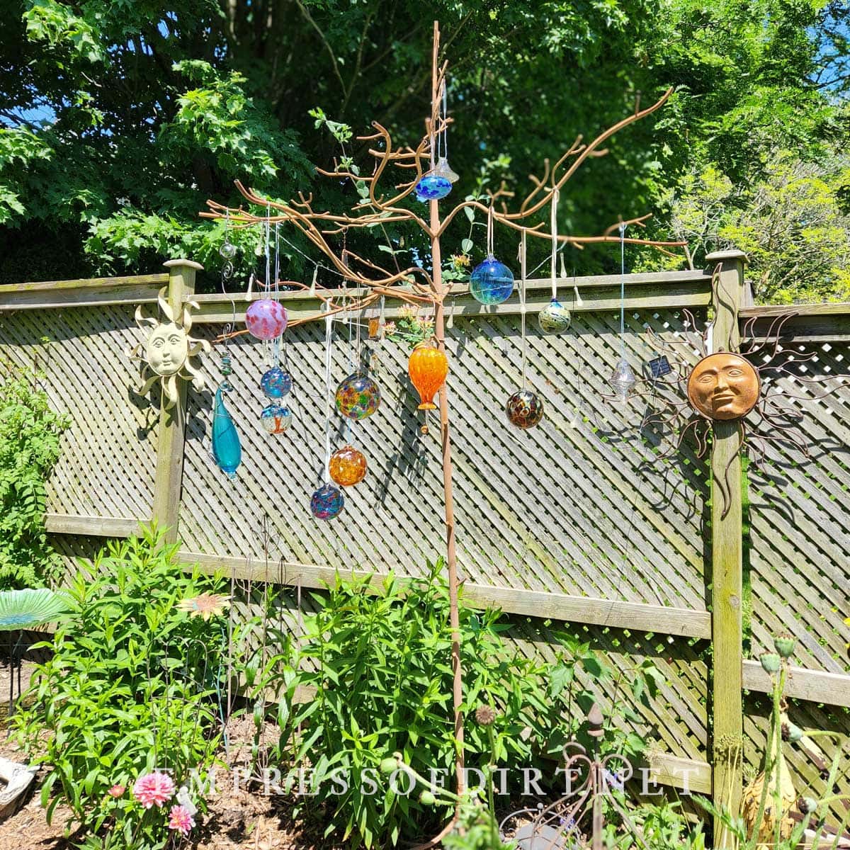 Collection of glass art in garden