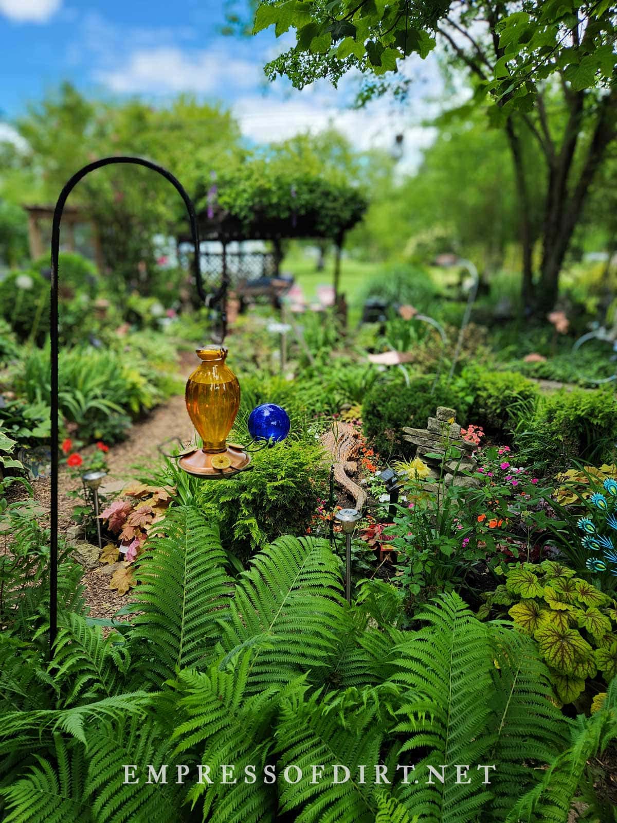 Colorful glass art hanging in garden