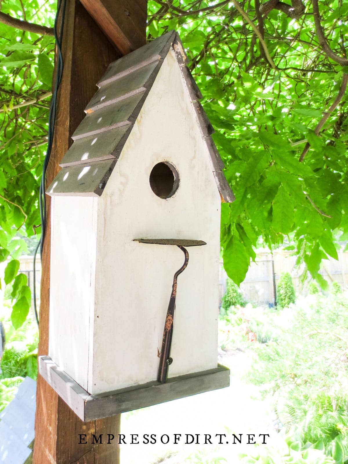 Trowel perch on decorative birdhouse