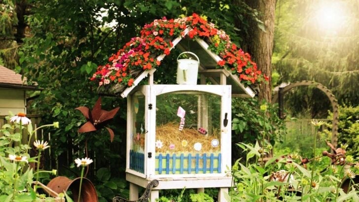 Shoebag planter over top of mini greenhouse.
