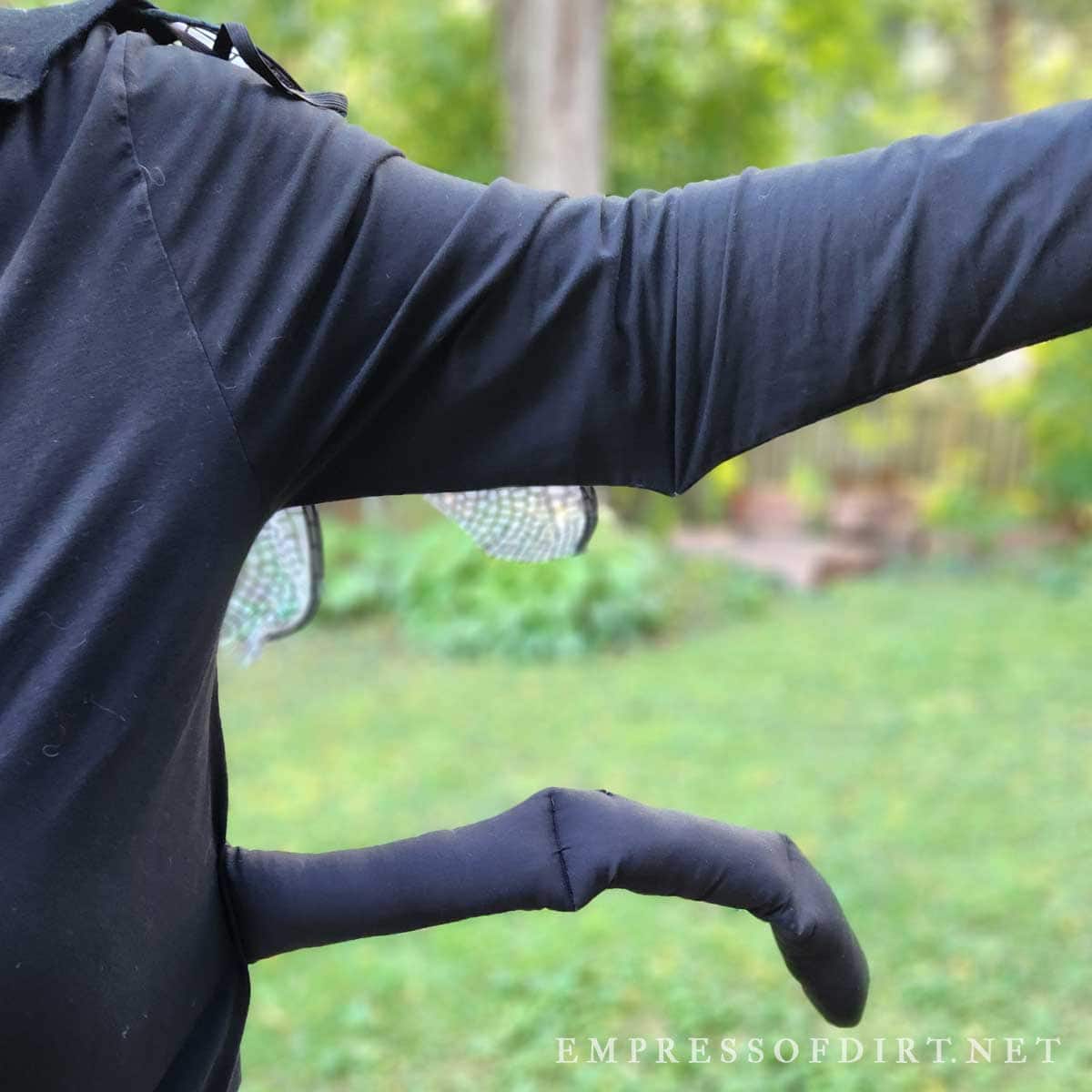 Close up of extra arms on firefly costume