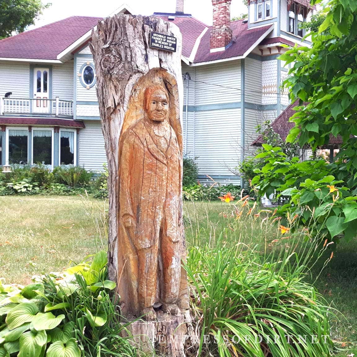 Carved tree stump man